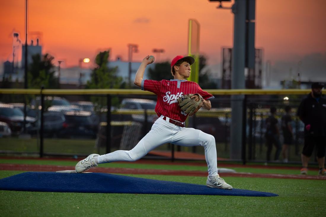 Baseball pitcher at sunset